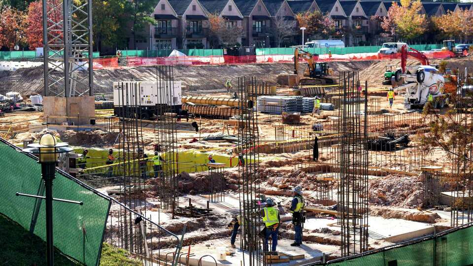 Construction continues on an apartment building at One Riva Row on Wednesday, Dec. 6, 2023 in The Woodlands.