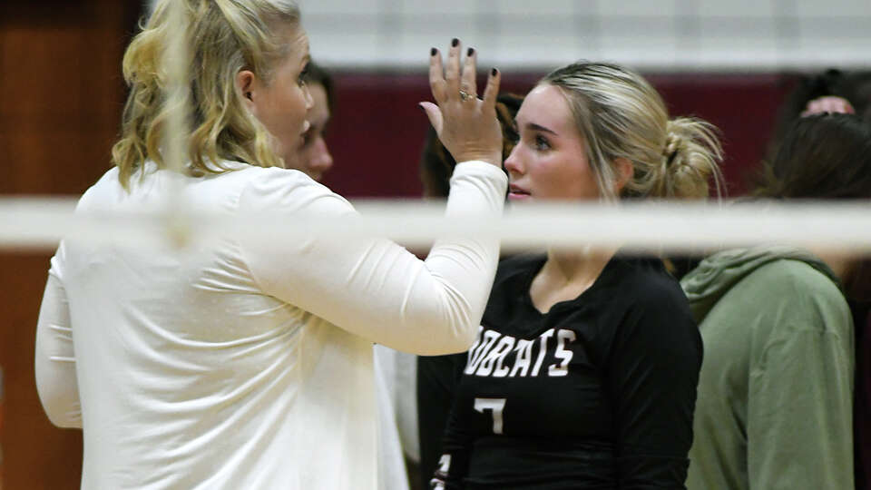 Cy-Fair senior outside hitter Kenna Webb, right, gets some one-on-one instruction from Asst. Coach Lyndsay Hodges during a timeout against Stratford in the second set of their district matchup at Cy-Fair High School on Oct. 4, 2022.