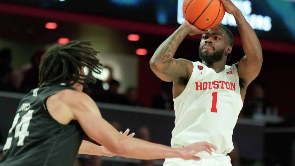 Houston Cougars guard Jamal Shead (1) shoots a 3-pointer during the second half of an NCAA college basketball game at the Fertitta Center, Wednesday, Dec. 6, 2023, in Houston.