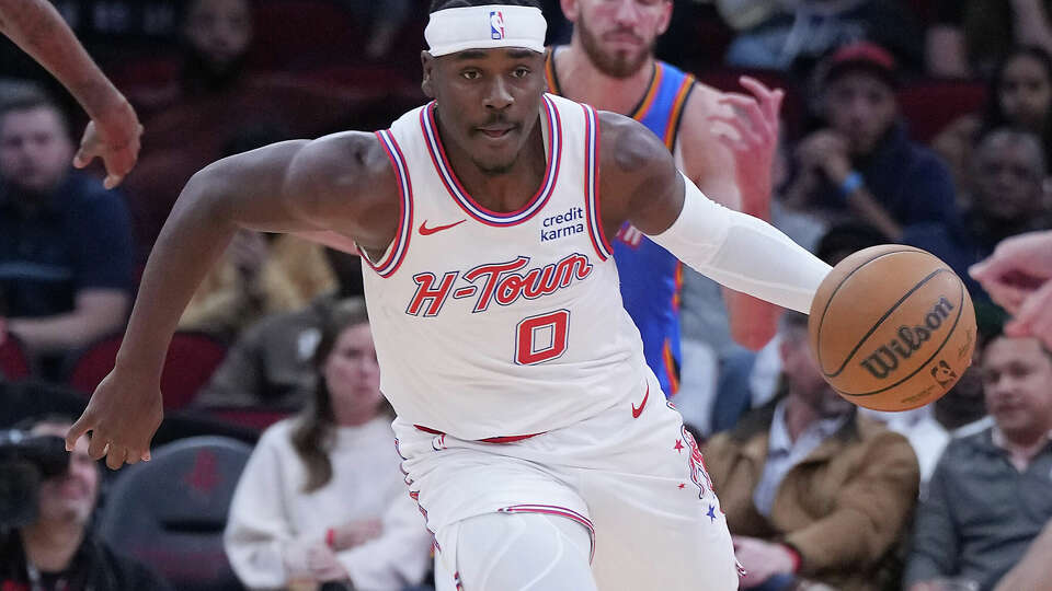 Houston Rockets guard Aaron Holiday (0) drives the ball up court against Oklahoma City Thunder in the first half of game action at the Toyota Center on Wednesday, Dec. 6, 2023 in Houston.