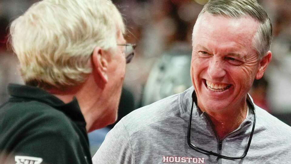 Houston head football coach Willie Fritz visits with fans before an NCAA college basketball game at the Fertitta Center, Wednesday, Dec. 6, 2023, in Houston.