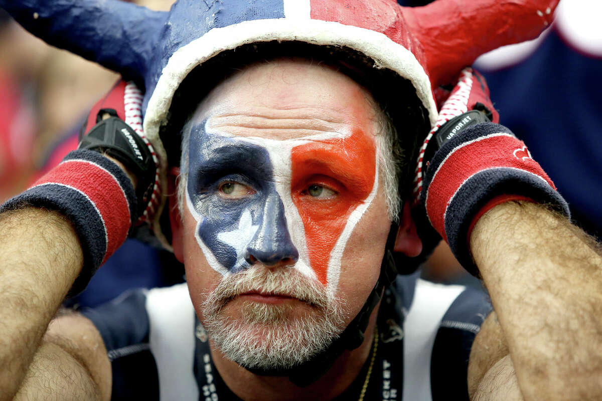 A Houston Texans fan looks depressed as the Minnesota Vikings defeat the Houston Texans on December 23, 2012 at Reliant Stadium in Houston, Texas.