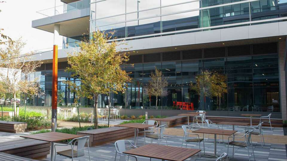 A furnished patio is among the amenities provided to tenants of the 53 acre Llfe-sciences mixed use district, Levit Green, in addition to landscaped walk and bike paths with lakes and green spaces near the medical center in Houston.