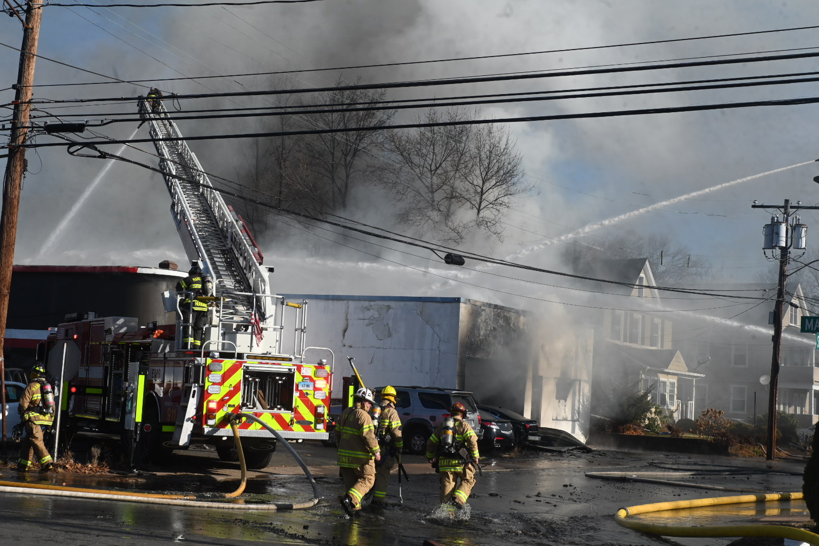 Fire at Manchester dealership fire damaged nearby home, officials say