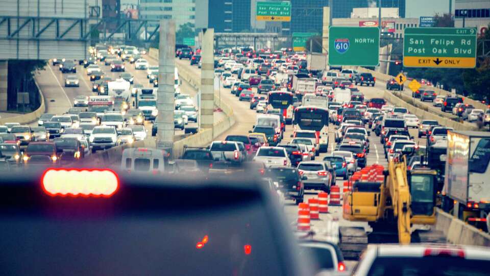 Traffic moves along the 610 West Loop during rush hour, Friday, Jan. 7, 2022, in Houston.