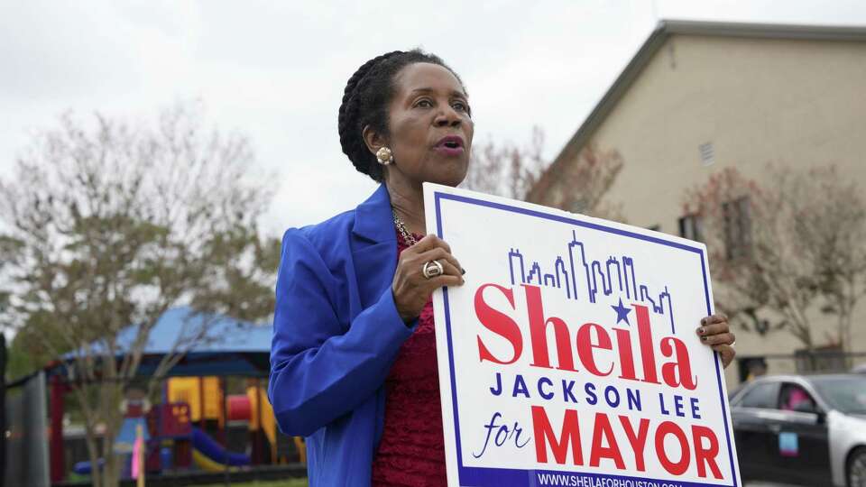 Mayoral candidate Sheila Jackson Lee greets people on their way to the polls on Election Day on Saturday, Dec. 9, 2023, in Houston.