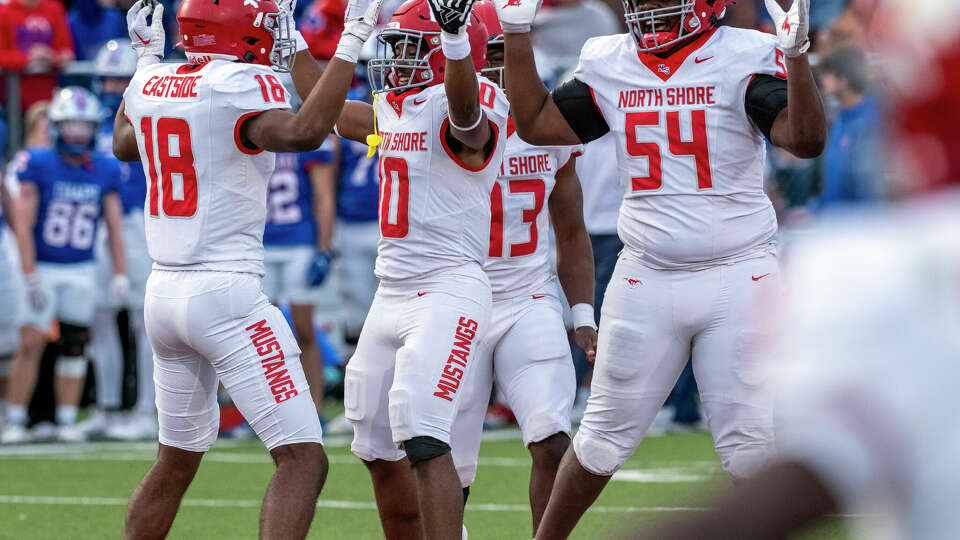 North Shore Jarvon Coles, (10), center, celebrates his first of two interceptions against Austin Westlake with teammates Charles Ross, (18), and Jacorey Kindle, (54), during the second half of 6A UIL high school football semifinal action held in Pflugerville, Texas, on Saturday, December 9, 2023. North Shore defeated Austin Westlake 23-14.