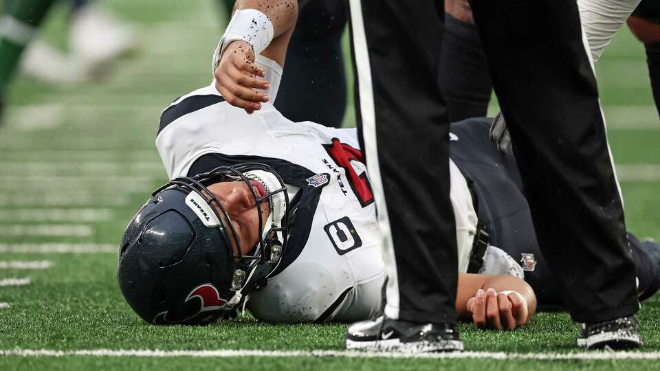 EAST RUTHERFORD, NEW JERSEY - DECEMBER 10: C.J. Stroud #7 of the Houston Texans on the field with an injury during the fourth quarter in the game against the New York Jets at MetLife Stadium on December 10, 2023 in East Rutherford, New Jersey.