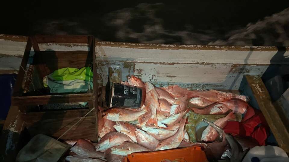 A 45-foot Response Boat–Medium crew from Coast Guard Station South Padre Island surveys approximately 440 pounds of red snapper found aboard a Mexican lancha approximately 10 miles offshore the southern Texas coast, Dec. 9, 2023. The RB–M crew interdicted the lancha, detained four Mexican fishermen aboard, and transferred the detainees to U.S. Customs and Border Protection personnel for further processing. (U.S. Coast Guard photo, courtesy Station South Padre Island)