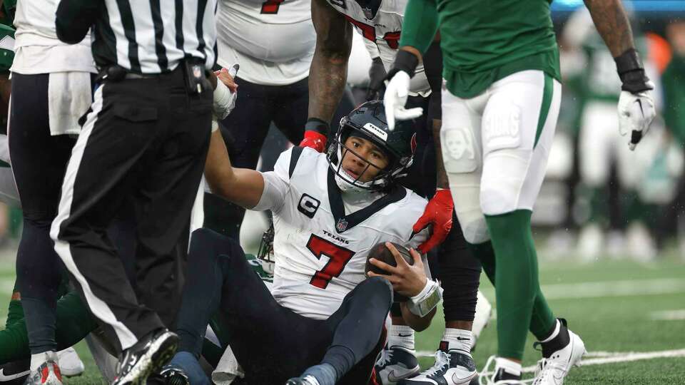 EAST RUTHERFORD, NEW JERSEY - DECEMBER 10: C.J. Stroud #7 of the Houston Texans is sacked during the third quarter in the game against the New York Jets at MetLife Stadium on December 10, 2023 in East Rutherford, New Jersey.