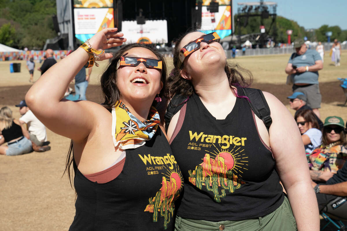 Festival goers watch the solar eclipse during 2023 Austin City Limits Music Festival at Zilker Park on October 14, 2023 in Austin, Texas. 