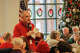 Senior Services Executive Director Charlie Schwedler greets those attending the Christmas luncheon last December.