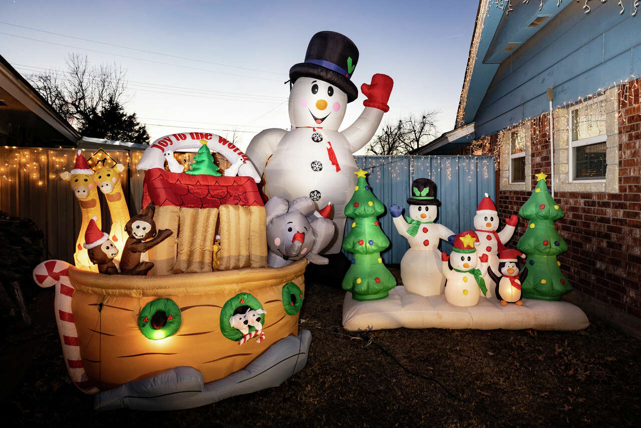 Glowing inflatables, including snowmen, Christmas trees and Noah's ark, are part of Leonard Mosely Christmas display in Del City, Oklahoma.