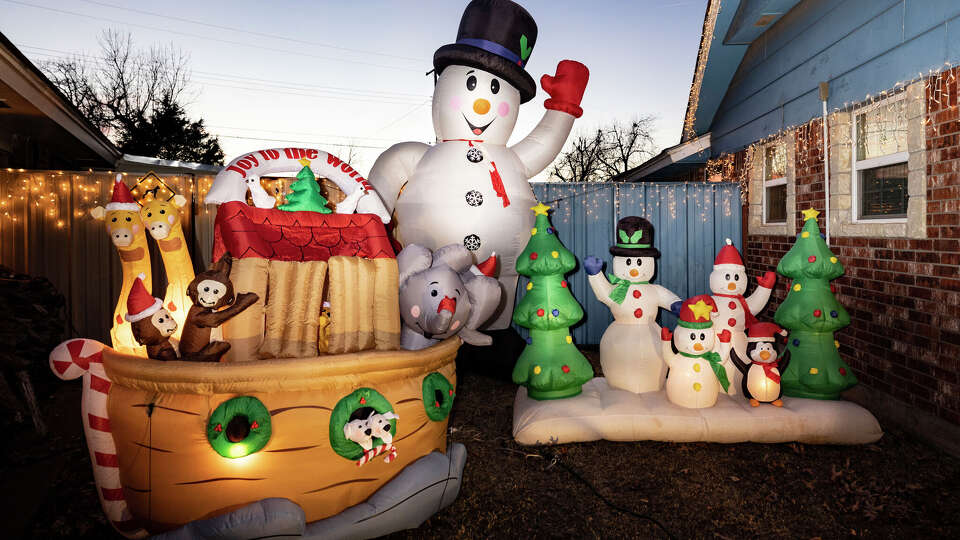 Glowing inflatables, including snowmen, Christmas trees and Noah's ark, are part of Leonard Mosely Christmas display in Del City, Oklahoma.