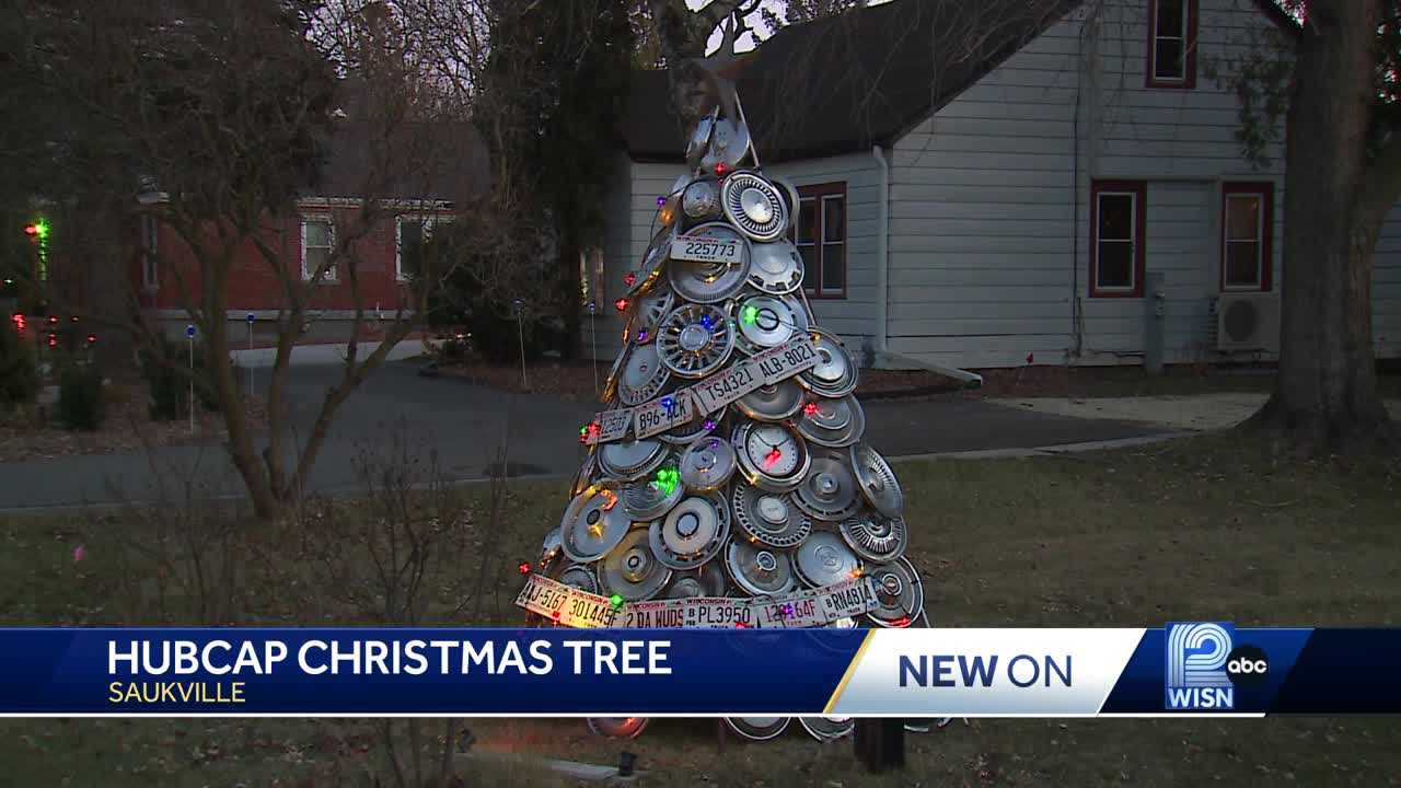 Welding around the hubcap tree Craftsman makes holiday sculpture out