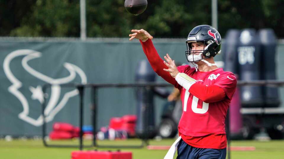 Houston Texans quarterback Davis Mills throws a football during practice on Thursday, Dec. 14, 2023, at Houston Methodist Training Center in Houston, as the Texans prepare for their matchup against the Tennessee Titans.