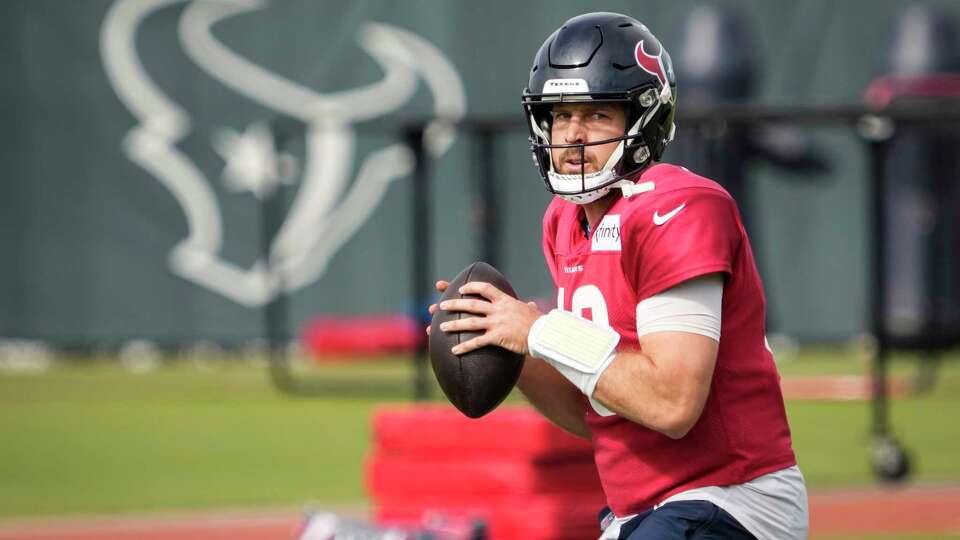 Houston Texans quarterback Case Keenum drops back to pass during practice on Thursday, Dec. 14, 2023, at Houston Methodist Training Center in Houston, as the Texans prepare for their matchup against the Tennessee Titans.