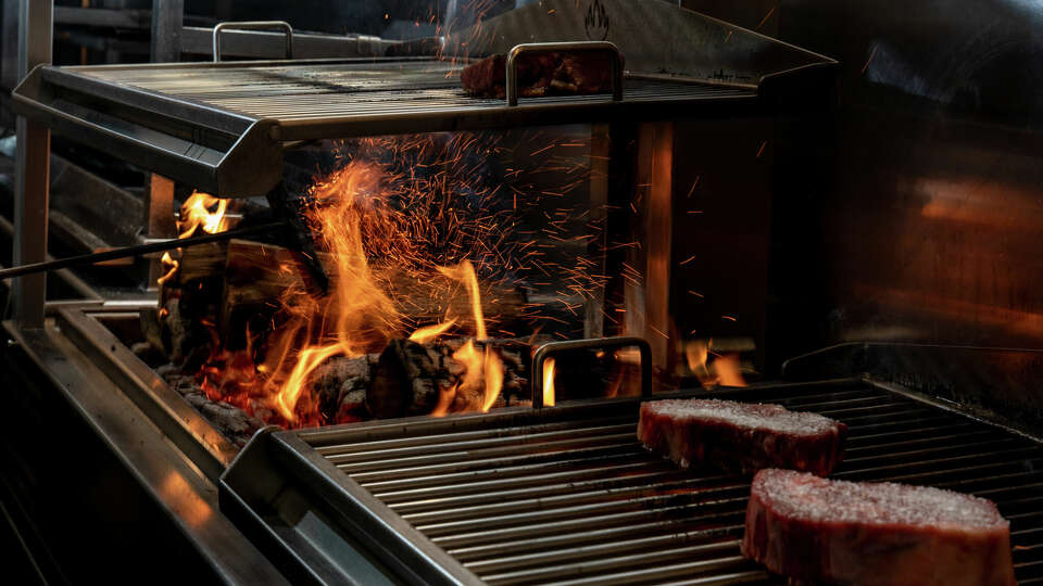 Andiron steakhouse in Houston utilizes live fire cooking.