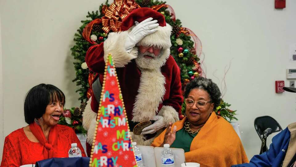 Santa visits more than 200 Fort Bend seniors as they gather for a Meals on Wheels holiday gathering on Friday, Dec. 15, 2023, at Bud O' Shieles Community Center in Rosenberg. The event is part of NRG WA Parish's ongoing collaboration with Fort Bend Seniors Meals on Wheels 'Great Gatherings' initiative designed to bring seniors together for fun and fellowship.