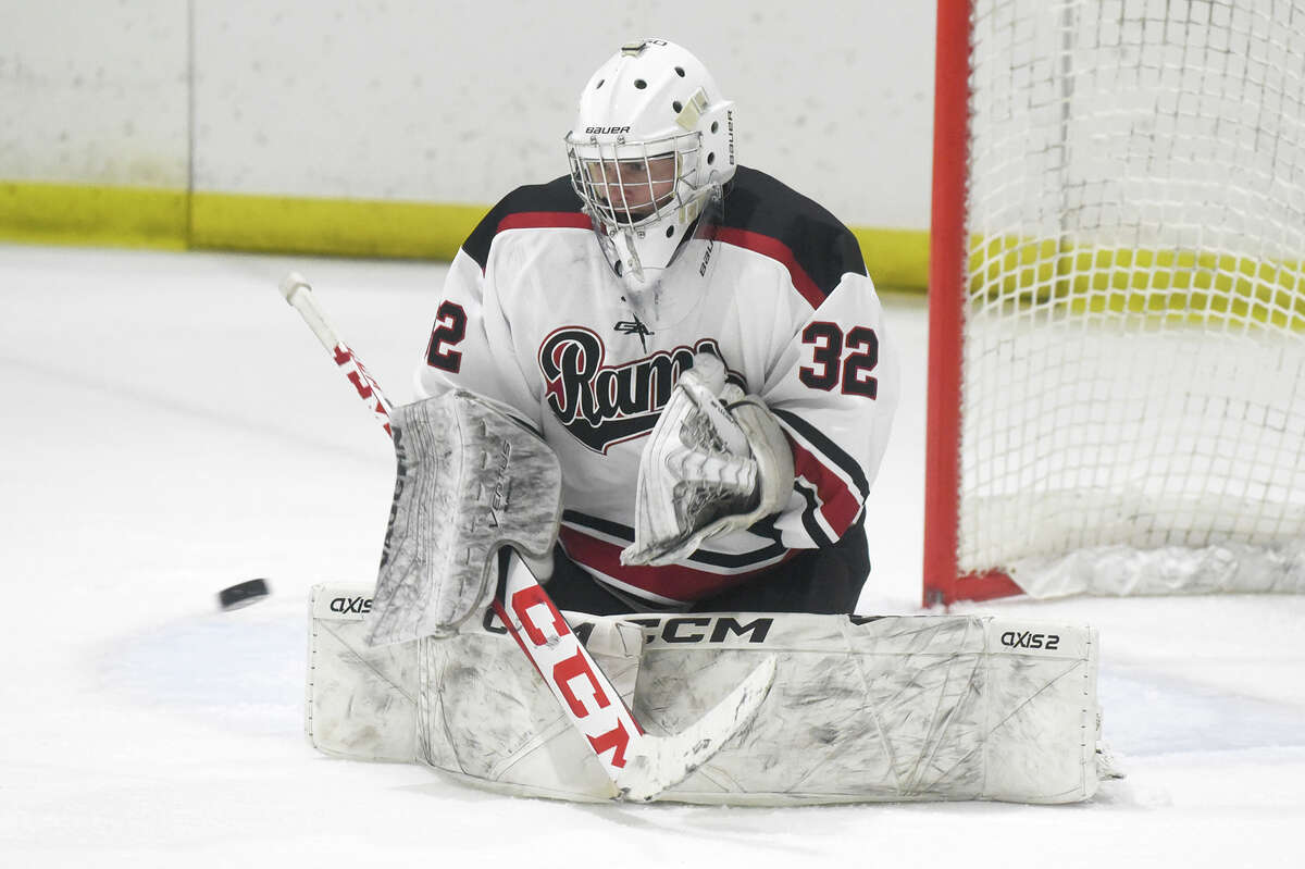 New Canaan goalie Mason Pickering (32) makes a save against Fairfield Prep during a boys ice hockey game at the Darien Ice House on Friday, Dec. 15, 2023.