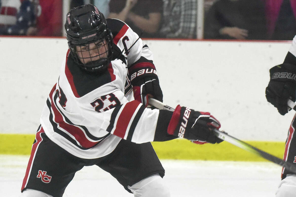 New Canaan's Doster Crowell (23) takes a shot against Fairfield Prep during a boys ice hockey game at the Darien Ice House on Friday, Dec. 15, 2023.