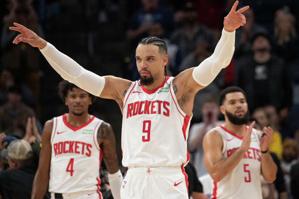 Houston Rockets guard Dillon Brooks (9) signals to the crowd as he is greeted with applause and a standing ovation during the first half of the team's NBA basketball game against the Memphis Grizzlies on Friday, Dec. 15, 2023, in Memphis, Tenn. (AP Photo/Nikki Boertman)