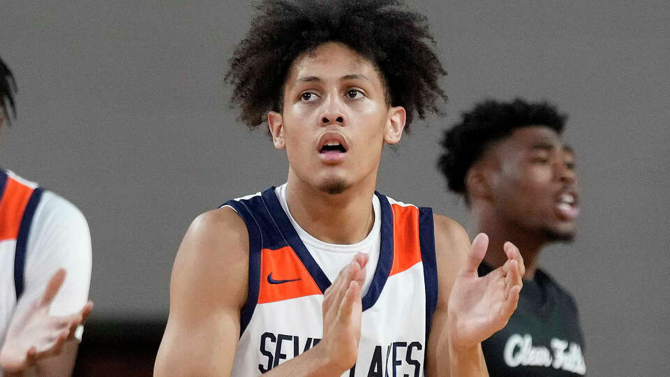 Seven Lakes guard AJ Bates (24) during a timeout during the first half of a Region III-6A semifinal high school basketball playoff game against Clear Falls, Friday, March 3, 2023, in Houston.