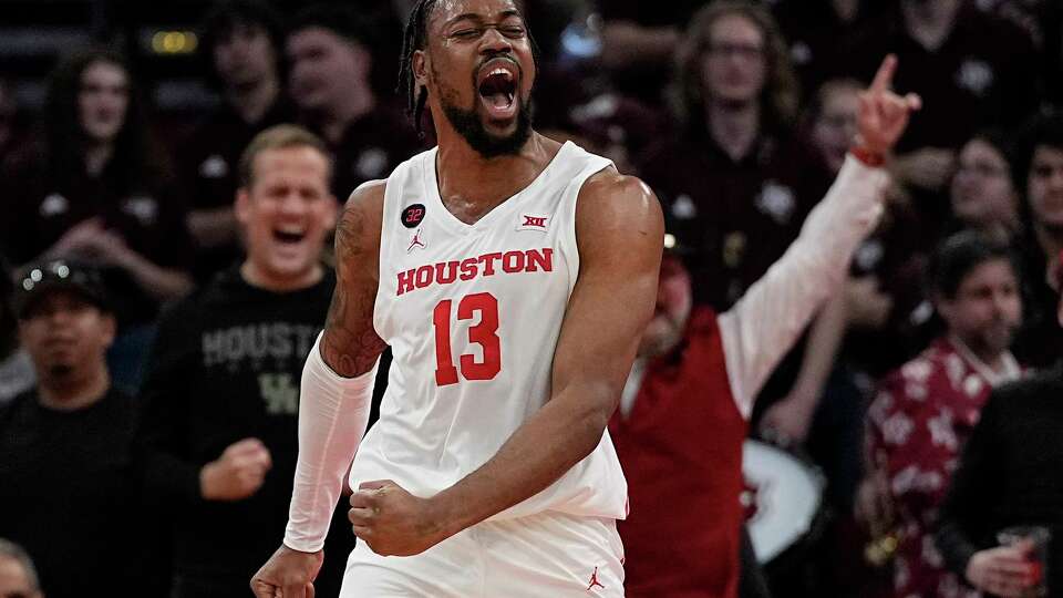 Houston forward J'Wan Roberts reacts after a basket during the first half of an NCAA college basketball game against Texas A&M, Saturday, Dec. 16, 2023, in Houston. (AP Photo/Kevin M. Cox)