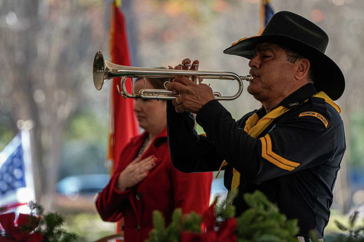 Rene Gonzalez plays TAPS during the opening of the Wreaths Across America ceremony, The Woodlands, Saturday, December 16, 2023