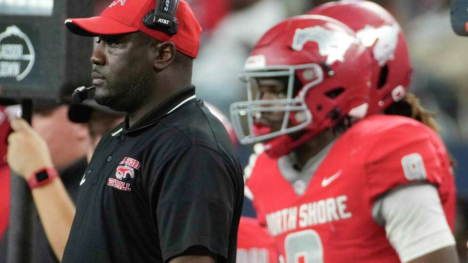 North Shore head coach Willie Gaston is seen alongside quarterback Kaleb Bailey during the second half of the 6A Division I UIL state championship game at AT&T Stadium, Saturday, Dec. 16, 2023, in Arlington.