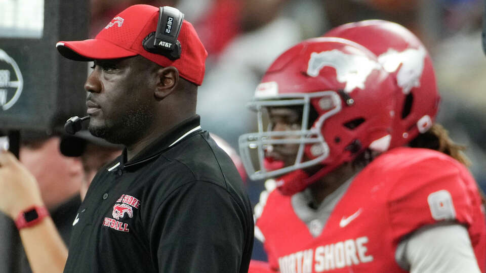 North Shore head coach Willie Gaston is seen alongside quarterback Kaleb Bailey during the second half of the 6A Division I UIL state championship game at AT&T Stadium, Saturday, Dec. 16, 2023, in Arlington.