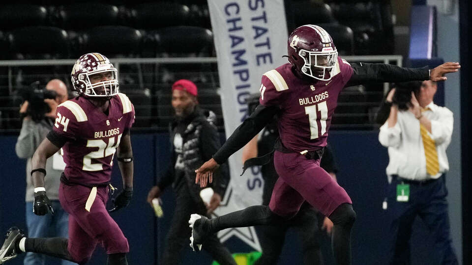 Summer Creek defensive end Kaleb Walker (11) celebrates after recovering a fumble during the first half of the 6A Division II UIL state championship game at AT&T Stadium, Saturday, Dec. 16, 2023, in Arlington.