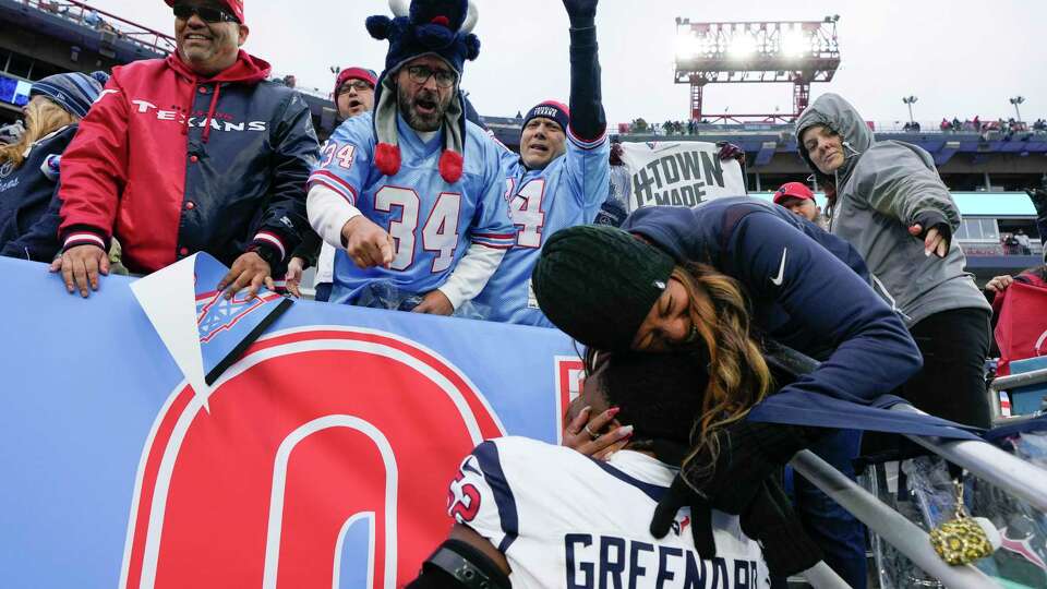 Houston Texans fans celebrate with defensive end Jonathan Greenard (52) after the team's 19-16 overtime win against the Tennessee Titans during an NFL football game on Sunday, Dec. 17, 2023 in Nashville, Tenn.
