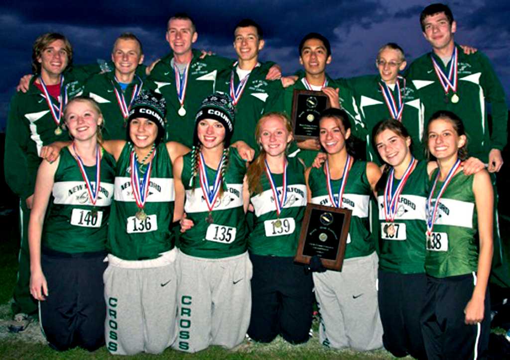 Green Wave 'rises to the occasion' NMHS boys, girls successfully defend