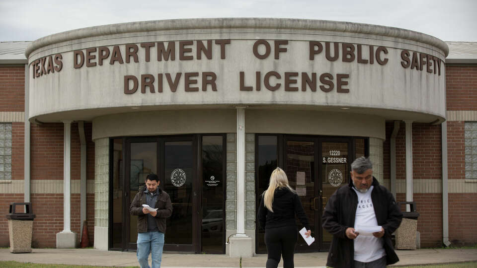 People leaving and coming in to the Texas Department of Public Safety Driver License Mega Center on South Gessner Road on Wednesday, Jan. 30, 2019, in Houston.