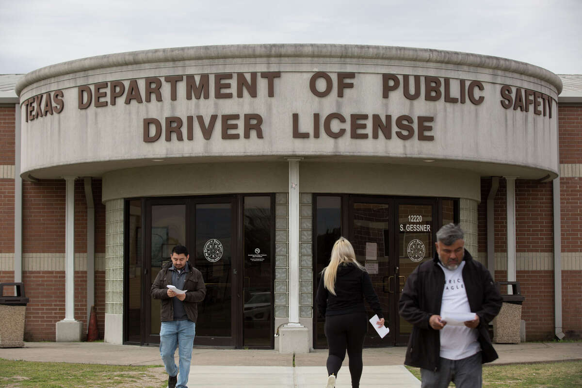 People leaving and coming in to the Texas Department of Public Safety Driver License Mega Center on South Gessner Road on Wednesday, Jan. 30, 2019, in Houston.
