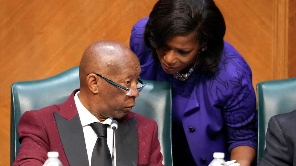 Mayor Sylvester Turner, left, talks to Marvalette Hunter, Turner’s chief of staff, as he presides over his final City Council meeting on Wednesday, Dec. 20, 2023 in Houston. Turner, who has served eight years as Houston’s mayor and is term limited, leaves office at the end of the year.