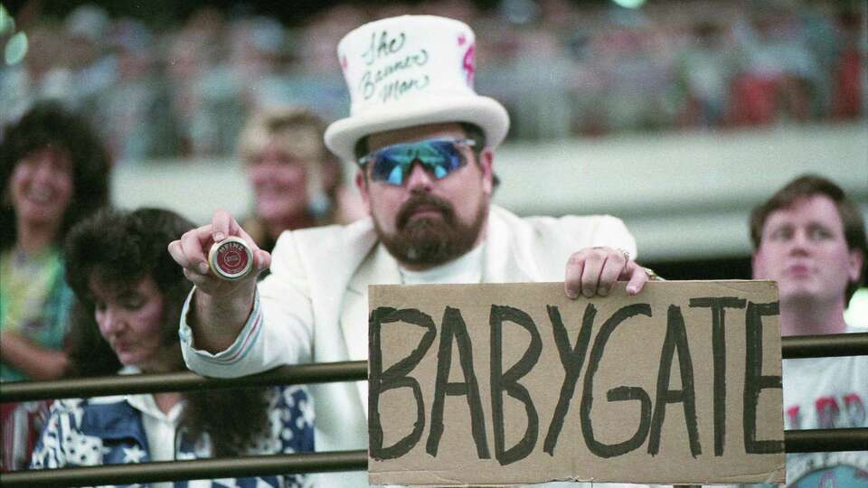 A fan in the Astrodome holds a jar of baby food in reference to the 'Babygate' debacle over the Oilers' decision to fine offensive tackle David Williams for recently skipping the New England game to see the birth of his son, Oct. 24, 1993.