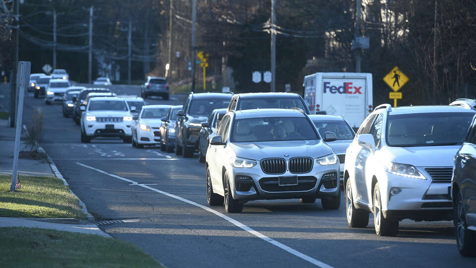 Eastbound traffic merges on Post Rd. as it travels from Southport towards downtown Fairfield, in Fairfield, Conn. Dec. 21, 2023.