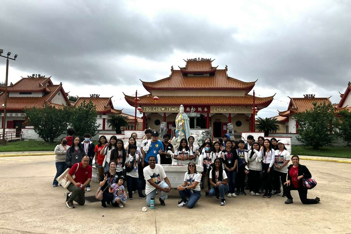 A group with Houston Asiatown Tours poses in front of Teo Chew Temple in west Houston.