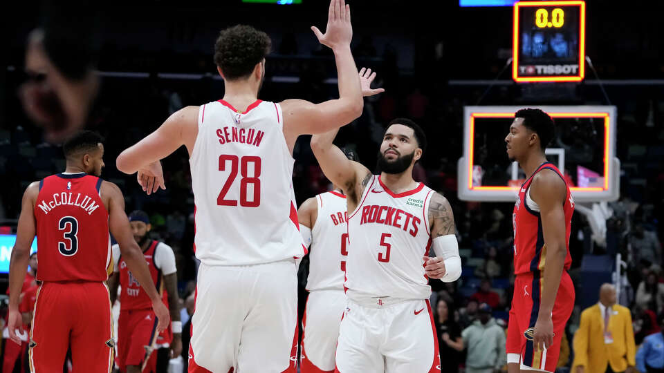 Houston Rockets center Alperen Sengun (28) celebrates with guard Fred VanVleet (5) after defeating the New Orleans Pelicans in an NBA basketball game in New Orleans, Saturday, Dec. 23, 2023. The Rockets won 106-104. (AP Photo/Gerald Herbert)