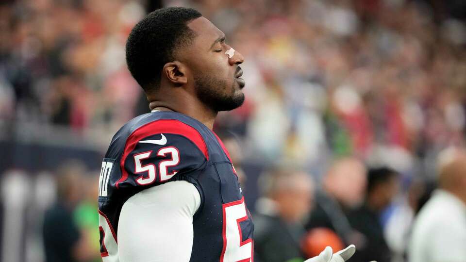 Houston Texans defensive end Jonathan Greenard (52) takes a moment with himself before the NFL game against the Cleveland Browns on Sunday, Dec. 24, 2023 at NRG Stadium in Houston.