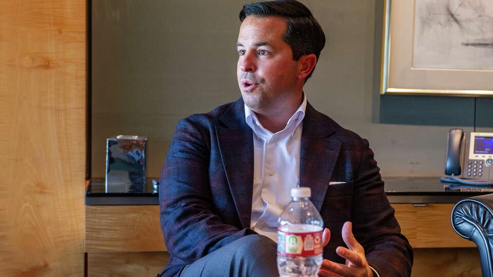 Jason Wells, who will take over as CenterPoint Energy CEO in Jan. 5, 2024, chats with media during a question and answer session Wednesday, Dec. 6, 2023 at CenterPoint Energy Tower in Houston.