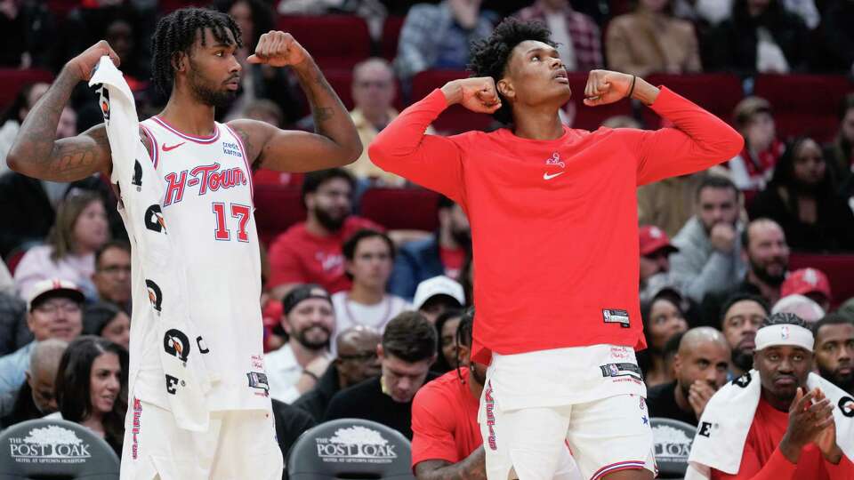 Houston Rockets forward Tari Eason (17) and forward Amen Thompson (1) react after teammate and forward Jeff Green drew a foul during the first half of an NBA basketball game at Toyota Center, Friday, Dec. 29, 2023, in Houston.