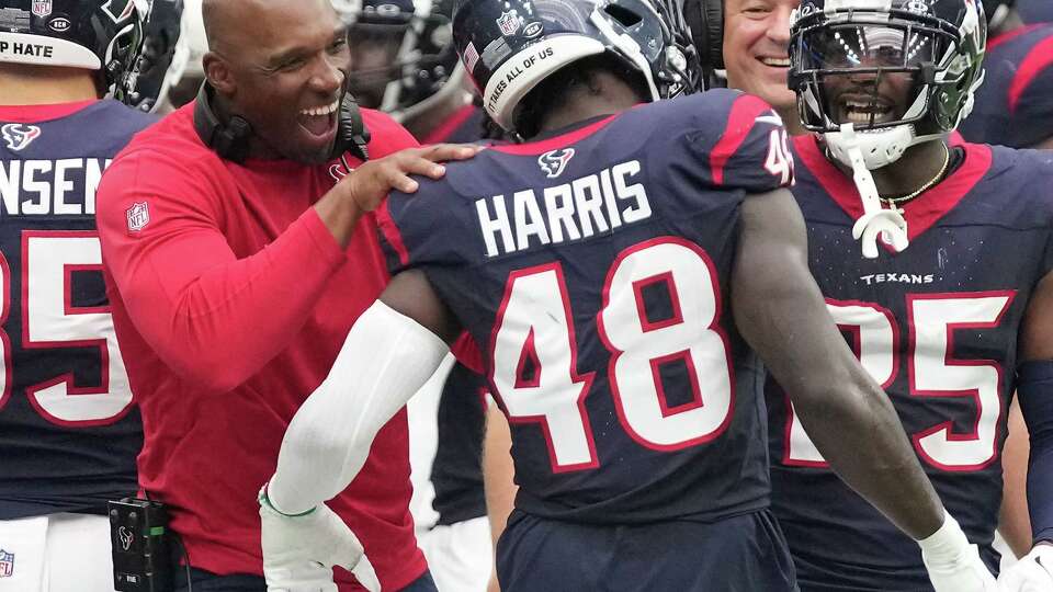 Houston Texans head coach DeMeco Ryans celebrates with Houston Texans linebacker Christian Harris (48) after he stopped a fourth-down and goal by the Tennessee Titans in the second half of NFL game action at NRG Stadium on Sunday, Dec. 31, 2023 in Houston.