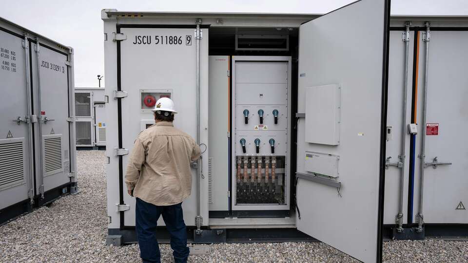 An employee works at a battery storage site in Saginaw owned and operated by Eolian L.P. 