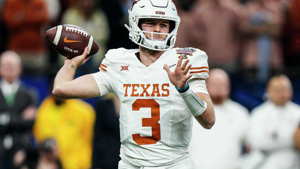 Texas quarterback Quinn Ewers (3) works in the pocket against Washington during the first half of the Sugar Bowl CFP NCAA semifinal college football game, Monday, Jan. 1, 2024, in New Orleans. (AP Photo/Jacob Kupferman)