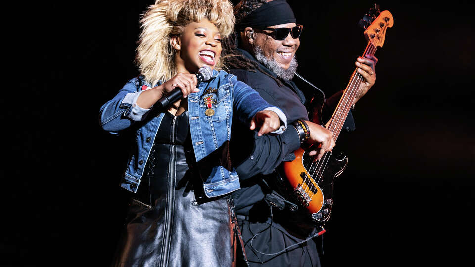 Ari Groover as 'Tina Turner' and John Toney (bass) in the North American tour of TINA - The Tina Turner Musical. 