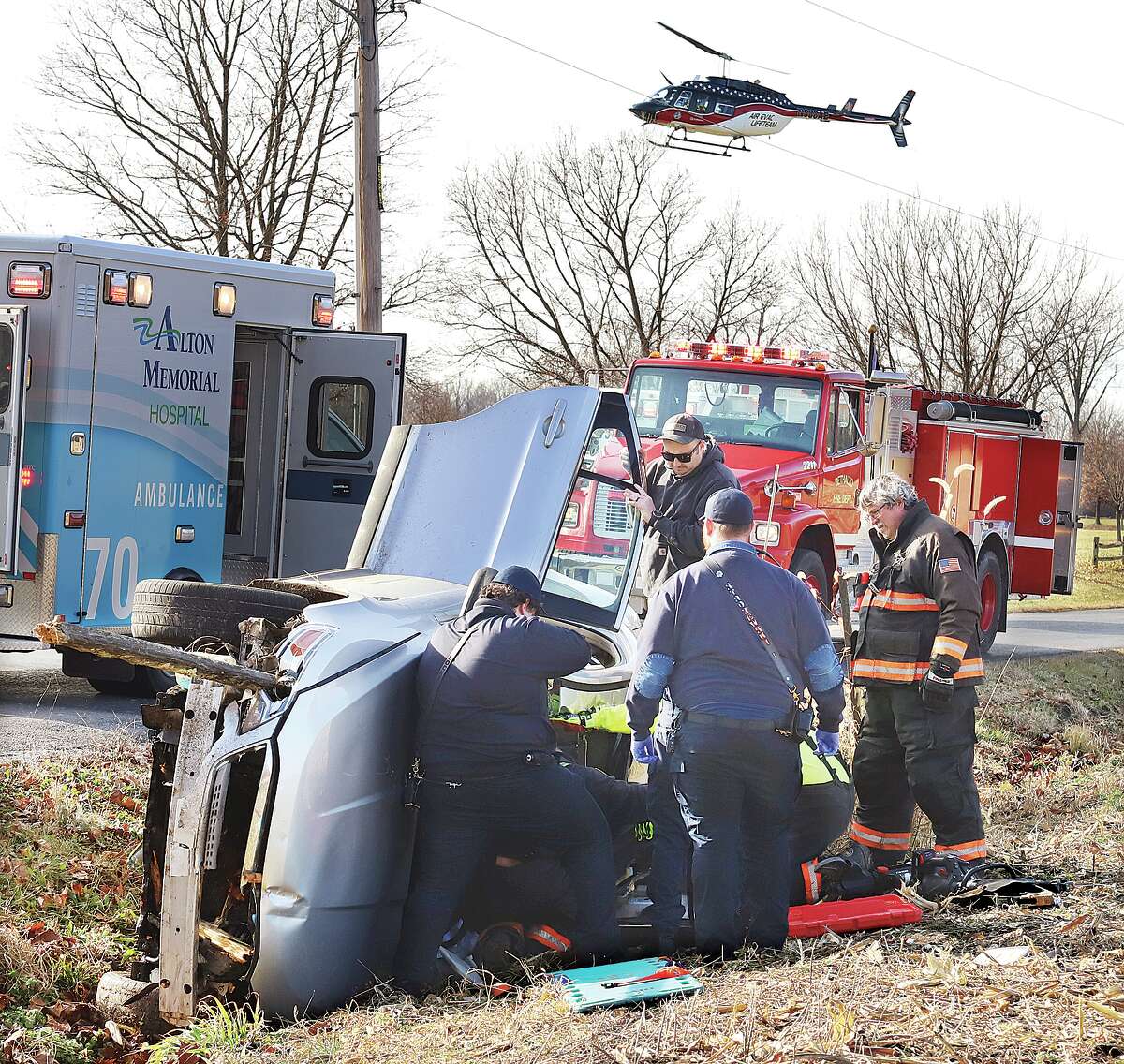 A helicopter ambulance comes in to land in Steve Bryant Community Park to airlift the driver to a St. Louis hospital.
