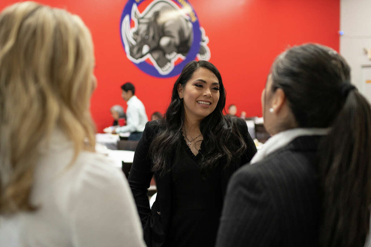 HENDERSON, NV - FEBRUARY 21: Former Congresswoman Mayra Flores, center, speaks with two people before the Americano Media Town Hall held at TorreÃ³n Fort Church and School in Henderson, NV, on Tuesday, February 21, 2023. Flores said the reason she ran in the special election was to inspire younger women to get involved with local politics. (Amber Garrett for The Washington Post via Getty Images)